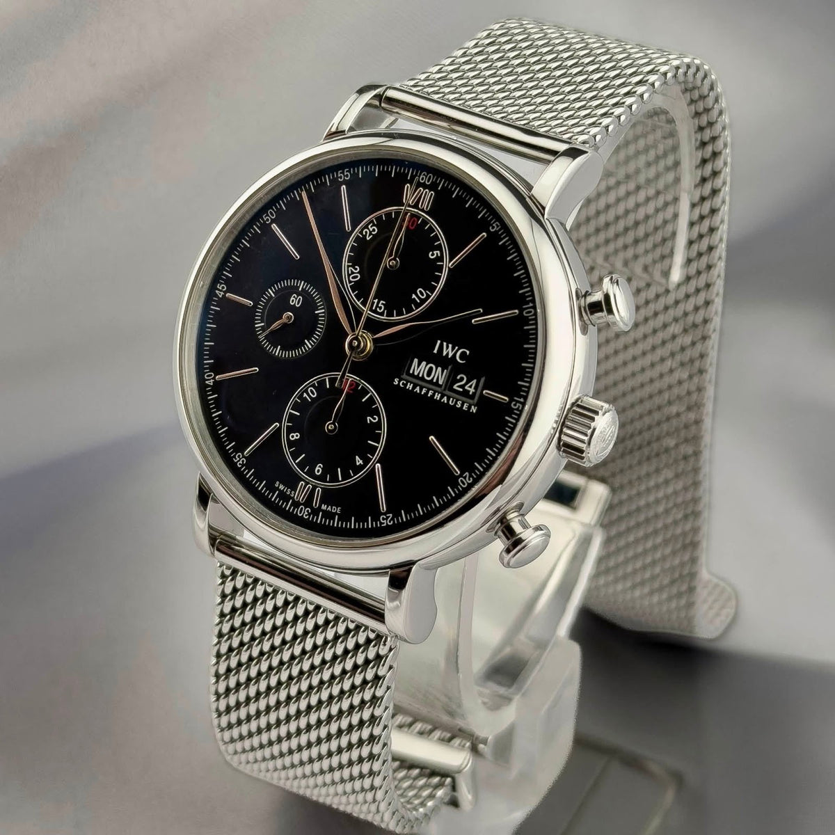 IWC Portofino Chronograph on display stand, Milanese mesh bracelet