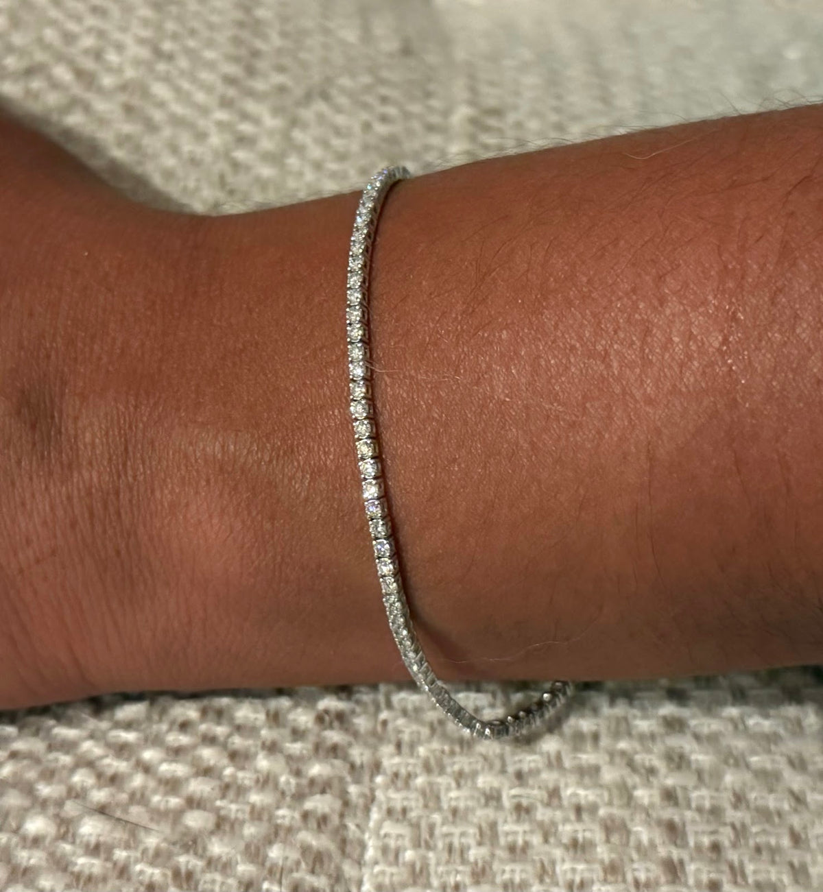 3 carat lab diamond tennis bracelet in 14K white gold worn on the wrist