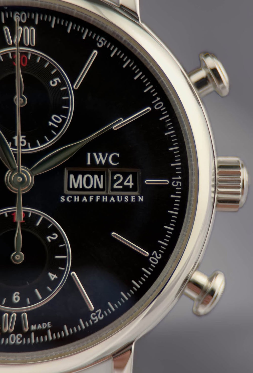 Close-up of IWC Portofino dial showing day and date window and applied indices