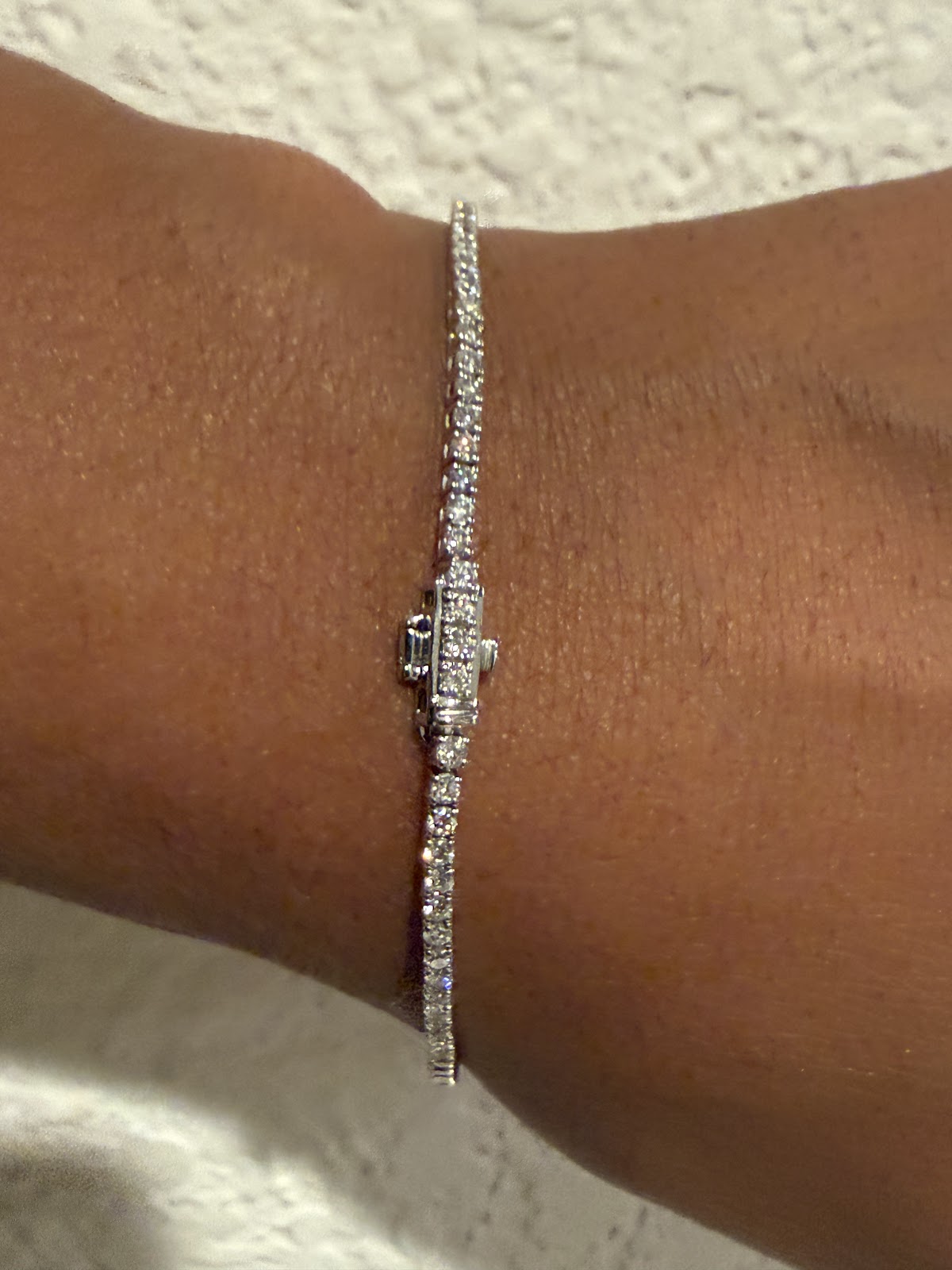 3 carat lab diamond tennis bracelet showing box clasp and safety latch on the wrist