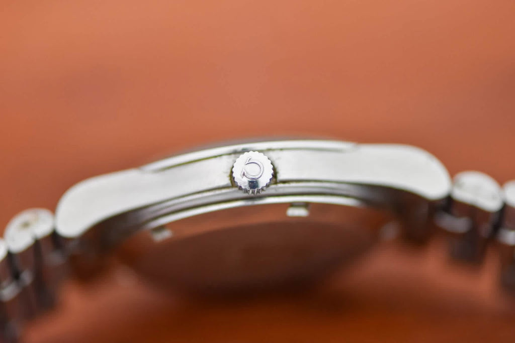 Omega Genève case profile showing crown and cushion case flank