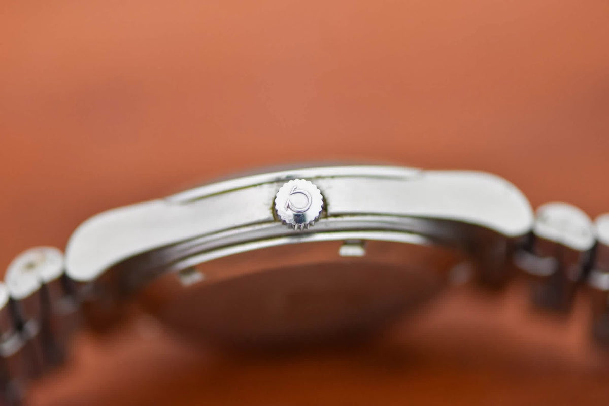 Omega Genève case profile showing crown and cushion case flank