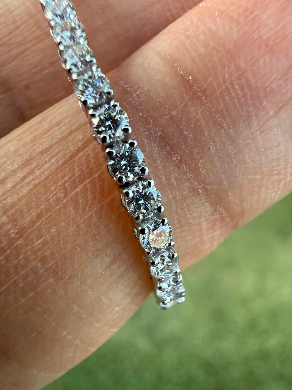 Lab diamond tennis bracelet showing brilliance and D-F color in daylight