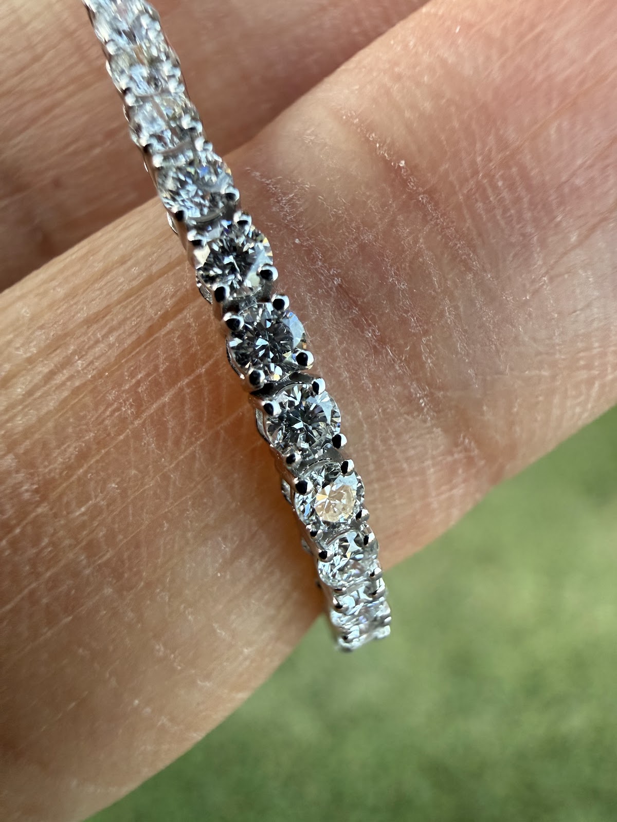 Lab diamond tennis bracelet showing brilliance and D-F color in daylight
