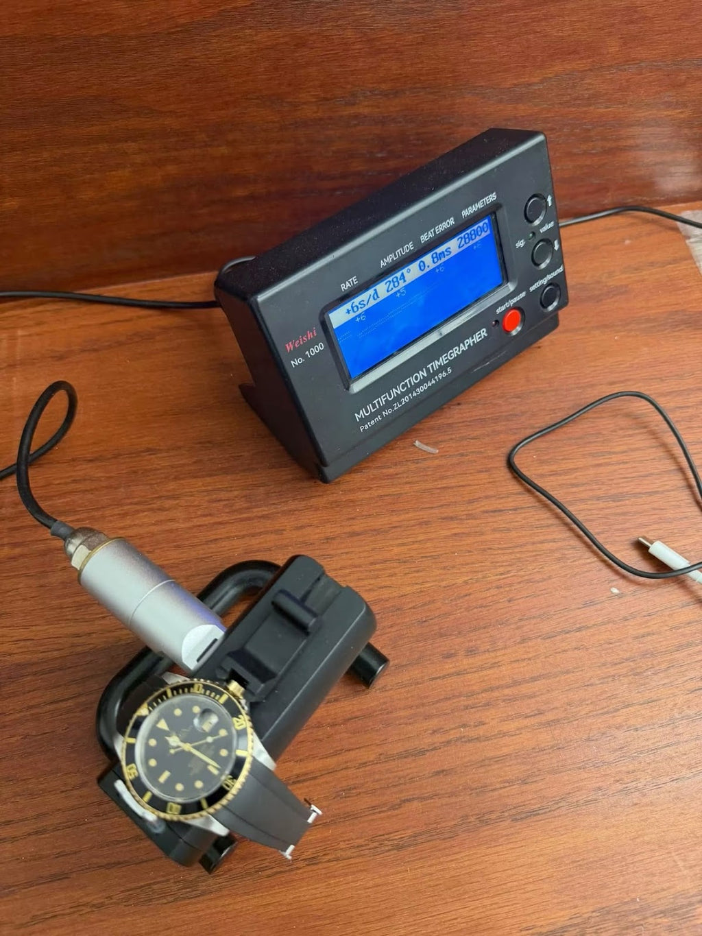 Timegrapher reading for the Rolex Submariner 16613 showing plus 6 seconds per day