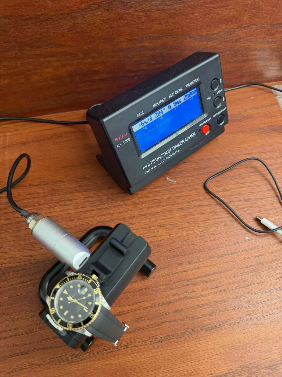 Timegrapher reading for the Rolex Submariner 16613 showing plus 6 seconds per day