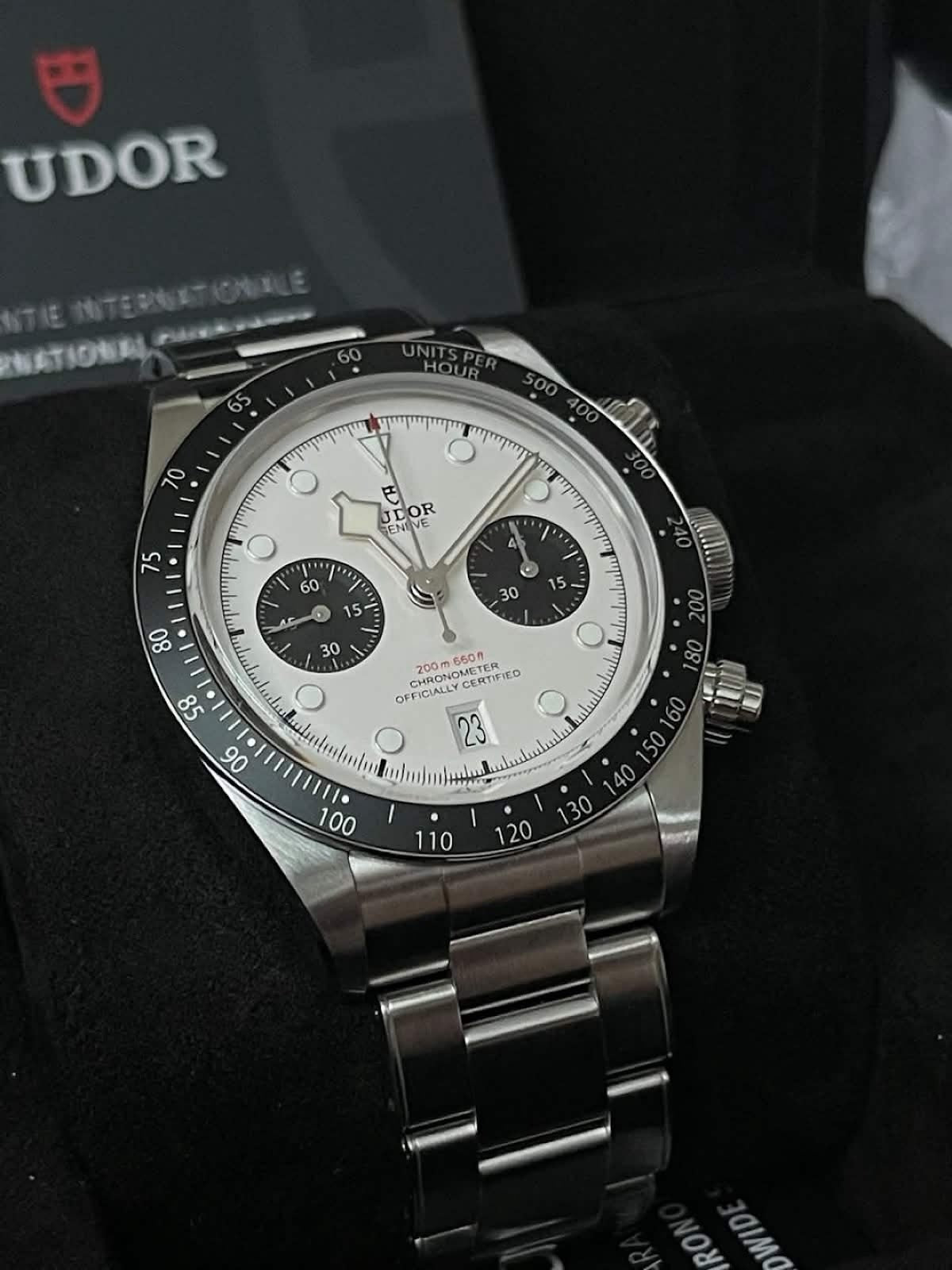 Tudor Black Bay Chrono white panda dial, angled view showing tachymeter bezel and pushers