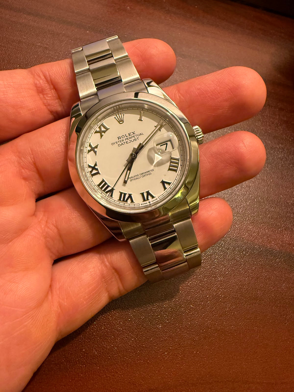 Rolex Datejust 41 Ref. 126300, white Roman dial with smooth bezel on Oyster bracelet