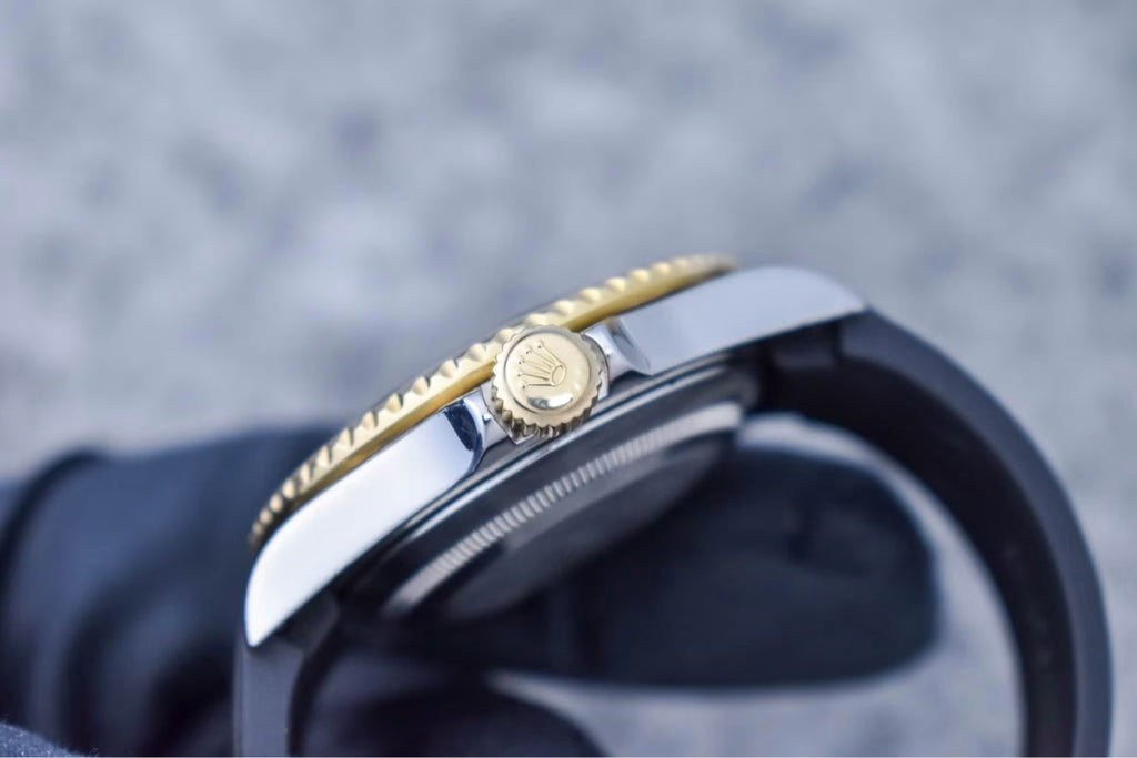 Rolex Submariner 16613 gold winding crown and case side detail