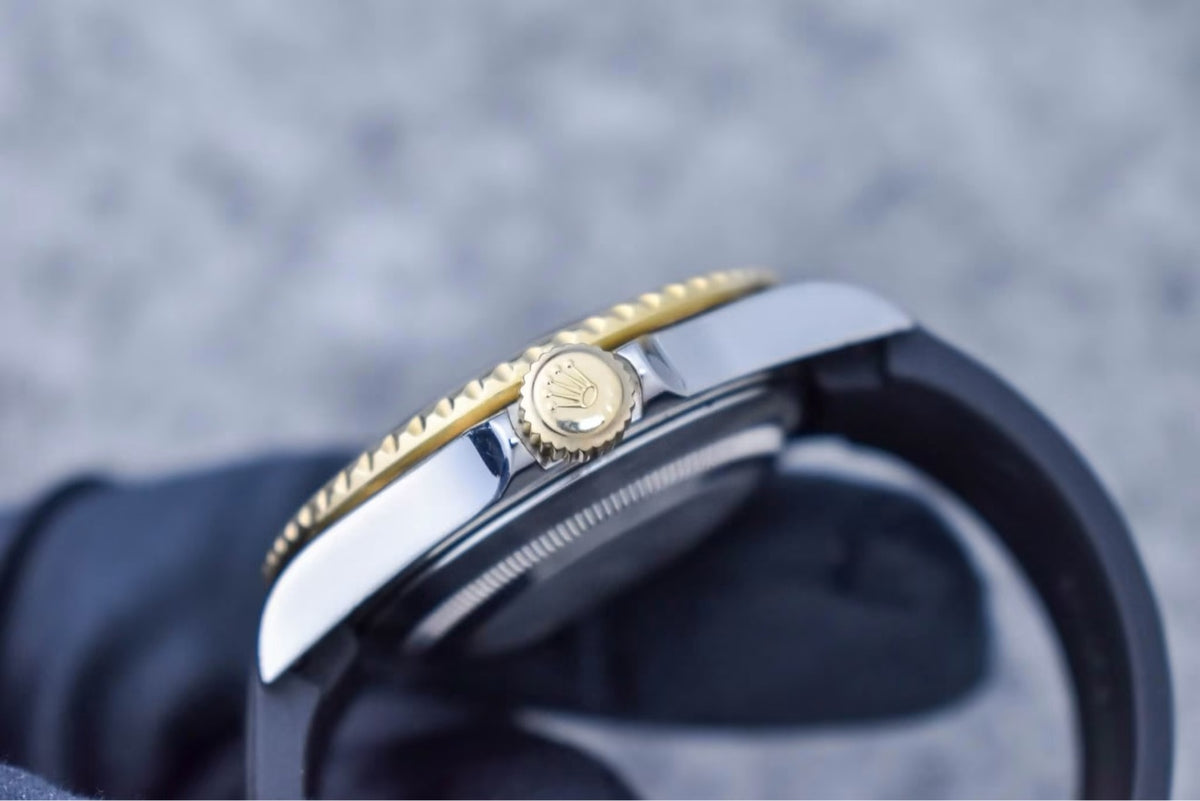 Rolex Submariner 16613 gold winding crown and case side detail